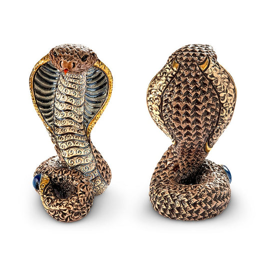 Hand-carved ceramic cobra figurine with enamel glaze, plated gold and platinum detailing. Measures approx 12×8×9 cm. Unique artisan sculpture from Uruguay. Ideal for collector’s display, spiritual décor, office accent, or thoughtful gift. Artisan ceramic snake sculpture. Small decorative cobra collectible. Handmade platinum-detail snake figurine.