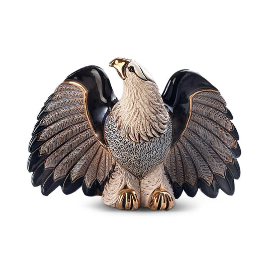 Hand‑carved bald eagle figurine with spread wings, metallic accents, 20 × 9 × 13 cm. Sculpture symbolizing freedom, strength, and craftsmanship. Artist-signed gift in elegant box. Symbol of Freedom.