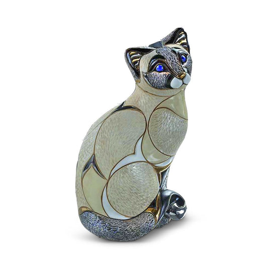 Hand‑carved ceramic Siamese cat sculpture standing with upright posture in ivory and beige tones, accented with delicate gold highlights. Crafted in Uruguay, 2008 limited edition piece. Ideal decorative ornament for cat lovers and artisan décor collectors. Decorative Siamese Cat Keepsake.