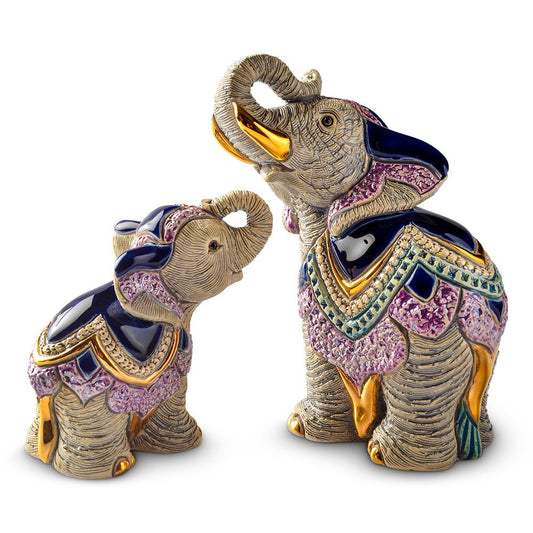 Hand‑carved elephant sculpture. Artisanal enamel elephant figurine. Small platinum‑accent animal figurine. Uruguayan handmade elephant statue. Gold‑trim elephant décor piece. Handcrafted and gift‑boxed for home décor or collector’s display.