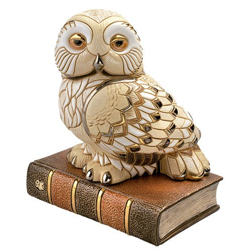 Hand‑painted ceramic owl perched on antique books, limited edition sculpture. Hand‑carved ceramic owl on book sculpture. Earthy tones, artisan‑crafted in 2009. Ideal for book lovers & scholars.
