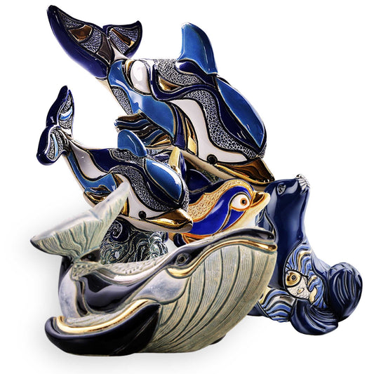 Handcrafted dolphin and whale figurines. De Rosa ceramic marine life set. Whale and seal decorative sculptures. Dolphin diving figurine collectible. Ocean animal ceramic art. Handmade sea creature statues. Blue enamel dolphin sculpture. Gold-accented ceramic whales. Artisanal marine life decor. Decorative humpback whale and seal
