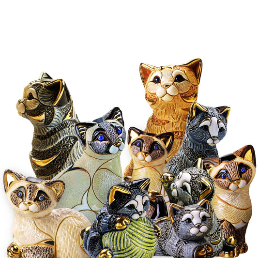 Handcrafted striped cat figurines. Enamel Siamese cat statue. Ceramic kitten with yarn. Handmade feline collectible set. Uruguayan cat figurines. Artisan cat sculptures with gold accents. Blue striped cat figurine. Cat lover gift sculpture set. Playful kitten ceramic statue. Siamese cat decor collectibles