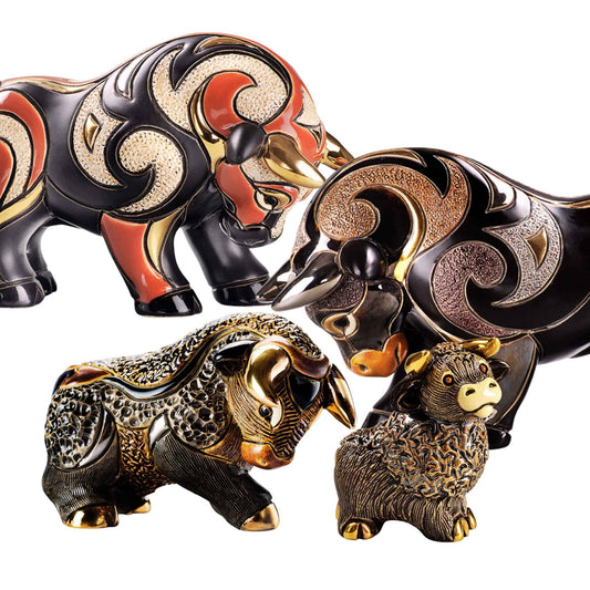 Handmade bull figurines. De Rosa ceramic bull statues. Red and black bull sculpture set. Bull and calf collectible art. Gold accented ceramic bulls. Enamel bull figurine bundle. Animal strength sculpture décor. Modern decorative bull statues. Hand-painted bull and oxen set. Luxury zodiac bull figurines