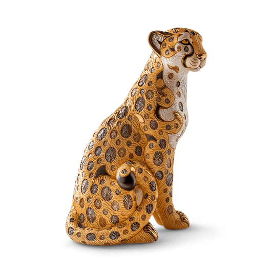 Handmade ceramic animal sculptures, specifically limited edition collectible wildlife figurines. Its materials and craftsmanship place it in the category of fine decorative ceramic art. Cheetah statue, luxury animal figurine, Uruguayan ceramic art, hand-painted ceramic cheetah, and gold-accented cheetah sculpture.