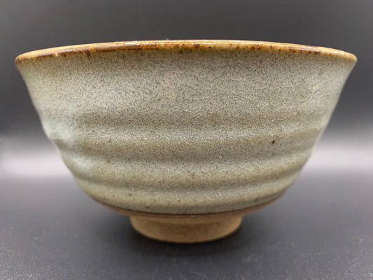 Japanese celadon pottery, handmade celadon tea bowl, ribbed ceramic tea bowl, carved leaf motif pottery, traditional Japanese ceramics, Longquan-style celadon ware, matcha chawan bowl, artisanal tea ceremony bowl, crackle glaze pottery, Song dynasty style ceramics, Japanese green glaze bowl, hand-thrown Japanese pottery, tea culture ceramics, Japanese chawan design, antique-style Japanese bowl, leaf pattern pottery, ribbed matcha bowl, celadon carving techniques, Japanese celadon glaze art, traditional Japa