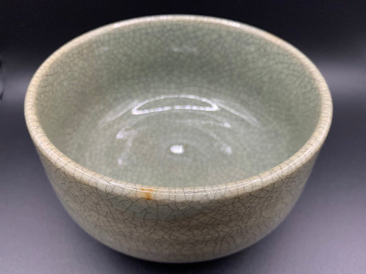 Japanese celadon pottery, handmade celadon tea bowl, ribbed ceramic tea bowl, carved leaf motif pottery, traditional Japanese ceramics, Longquan-style celadon ware, matcha chawan bowl, artisanal tea ceremony bowl, crackle glaze pottery, Song dynasty style ceramics, Japanese green glaze bowl, hand-thrown Japanese pottery, tea culture ceramics, Japanese chawan design, antique-style Japanese bowl, leaf pattern pottery, ribbed matcha bowl, celadon carving techniques, Japanese celadon glaze art, traditional Japa