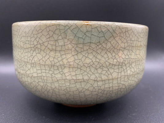Japanese celadon pottery, handmade celadon tea bowl, ribbed ceramic tea bowl, carved leaf motif pottery, traditional Japanese ceramics, Longquan-style celadon ware, matcha chawan bowl, artisanal tea ceremony bowl, crackle glaze pottery, Song dynasty style ceramics, Japanese green glaze bowl, hand-thrown Japanese pottery, tea culture ceramics, Japanese chawan design, antique-style Japanese bowl, leaf pattern pottery, ribbed matcha bowl, celadon carving techniques, Japanese celadon glaze art, traditional Japa