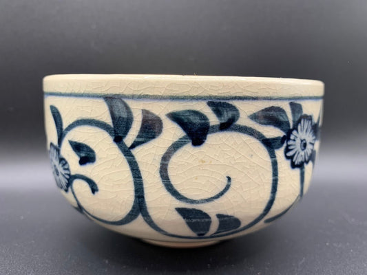 Japanese celadon pottery, handmade celadon tea bowl, ribbed ceramic tea bowl, carved leaf motif pottery, traditional Japanese ceramics, Longquan-style celadon ware, matcha chawan bowl, artisanal tea ceremony bowl, crackle glaze pottery, Song dynasty style ceramics, Japanese green glaze bowl, hand-thrown Japanese pottery, tea culture ceramics, Japanese chawan design, antique-style Japanese bowl, leaf pattern pottery, ribbed matcha bowl, celadon carving techniques, Japanese celadon glaze art, traditional Japa