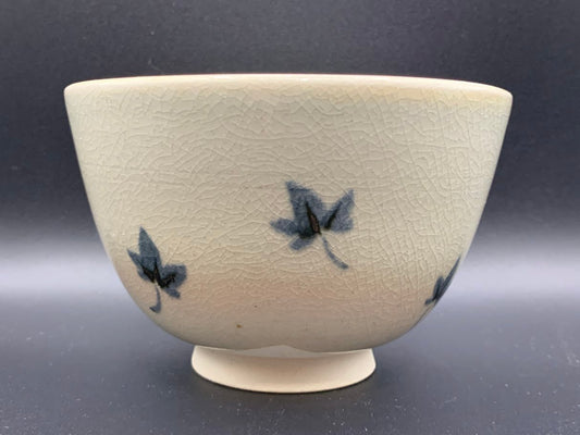 Japanese celadon pottery, handmade celadon tea bowl, ribbed ceramic tea bowl, carved leaf motif pottery, traditional Japanese ceramics, Longquan-style celadon ware, matcha chawan bowl, artisanal tea ceremony bowl, crackle glaze pottery, Song dynasty style ceramics, Japanese green glaze bowl, hand-thrown Japanese pottery, tea culture ceramics, Japanese chawan design, antique-style Japanese bowl, leaf pattern pottery, ribbed matcha bowl, celadon carving techniques, Japanese celadon glaze art, traditional Japa