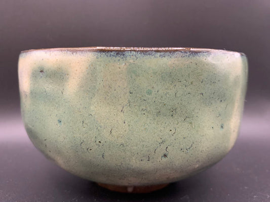 Japanese celadon pottery, handmade celadon tea bowl, ribbed ceramic tea bowl, carved leaf motif pottery, traditional Japanese ceramics, Longquan-style celadon ware, matcha chawan bowl, artisanal tea ceremony bowl, crackle glaze pottery, Song dynasty style ceramics, Japanese green glaze bowl, hand-thrown Japanese pottery, tea culture ceramics, Japanese chawan design, antique-style Japanese bowl, leaf pattern pottery, ribbed matcha bowl, celadon carving techniques, Japanese celadon glaze art, traditional Japa