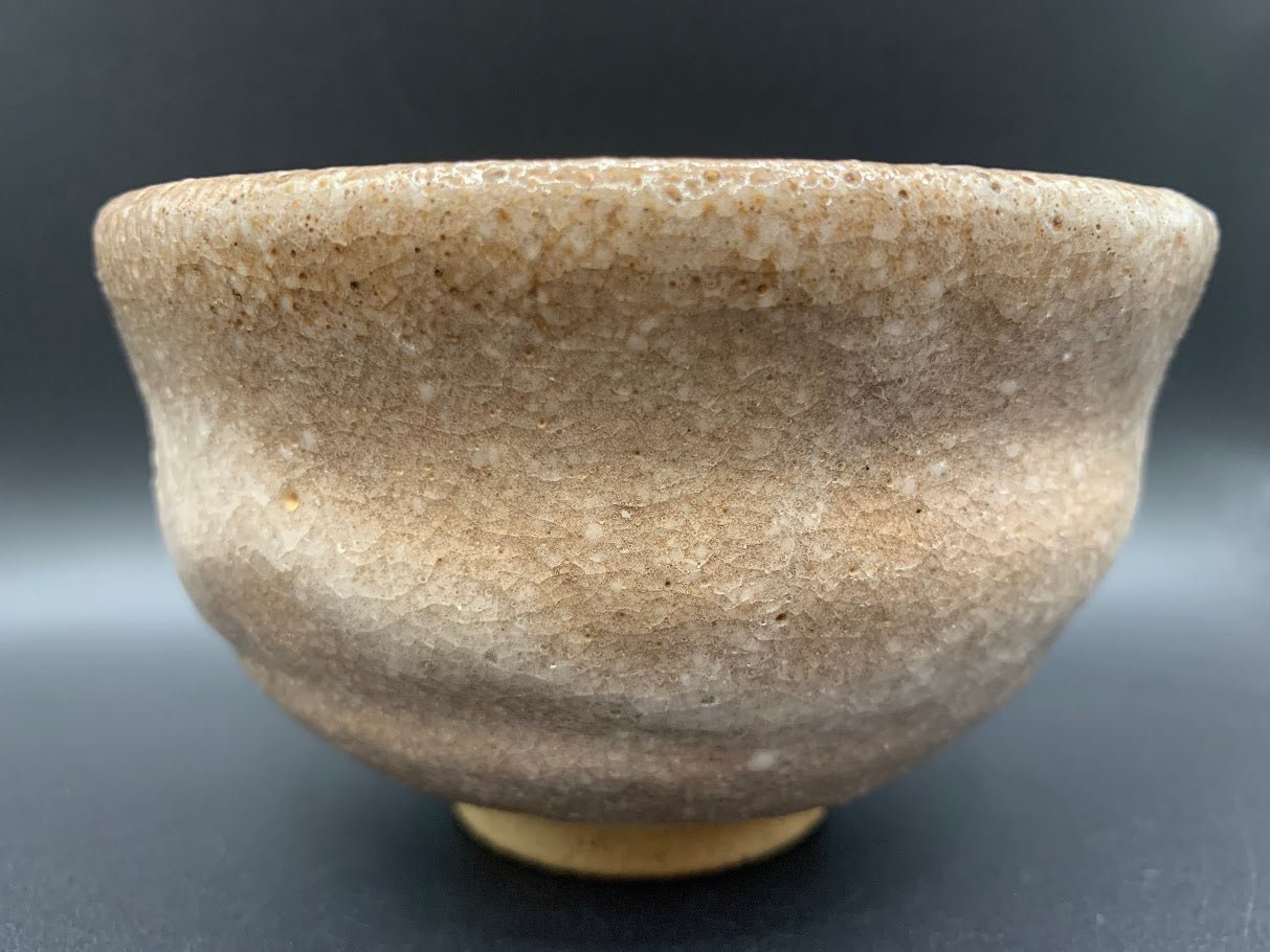 Japanese celadon pottery, handmade celadon tea bowl, ribbed ceramic tea bowl, carved leaf motif pottery, traditional Japanese ceramics, Longquan-style celadon ware, matcha chawan bowl, artisanal tea ceremony bowl, crackle glaze pottery, Song dynasty style ceramics, Japanese green glaze bowl, hand-thrown Japanese pottery, tea culture ceramics, Japanese chawan design, antique-style Japanese bowl, leaf pattern pottery, ribbed matcha bowl, celadon carving techniques, Japanese celadon glaze art, traditional Japa