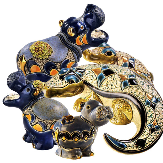 Nile crocodile and hippo figurine set. Ceramic hippo and crocodile sculptures. Handcrafted river animal figurines. Artisan hippo figurines with gold accents. Enamel crocodile home decor statue. De Rosa ceramic hippos and crocs. Wildlife animal ceramic figurines. Symbolic handmade hippo collectibles. Luxury ceramic river animals set. Artisan hippo and crocodile gift bundle
