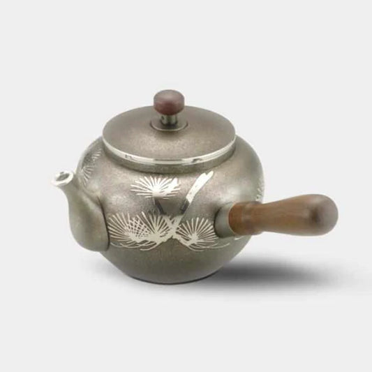 Osaka Naniwa Pewter Ware, Japanese pewter teapot, Kyusu Ibushi Yokote, tin Japanese teapot, handcrafted Japanese tinware, traditional Japanese teapot, Osaka Suzuki crafts, pewter Kyusu teapot, paulownia box tea set, Japanese artisan teaware, Edo period tinware tradition, crane pine motif teapot, Japanese cultural symbolism, tin teapot Japan, collectible Japanese teapot