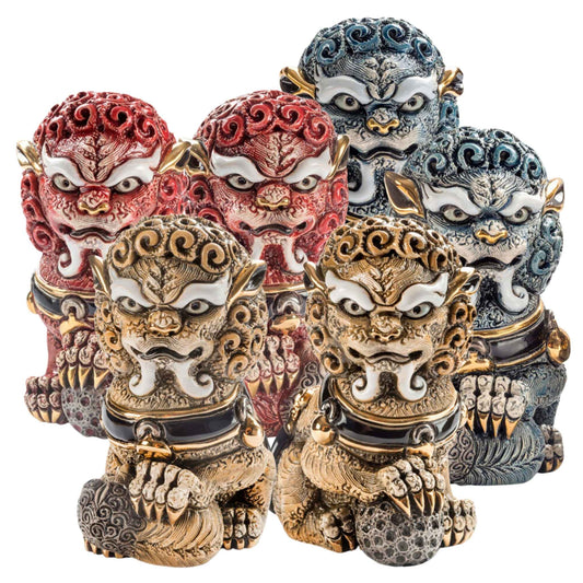 Set of six hand-painted ceramic Foo Lions featuring red, blue, and cinnamon male and female pairs, each glazed with gold, platinum, and enamel. These symbolic Feng Shui guardian lions are crafted by artisans in Uruguay and serve as powerful protectors.